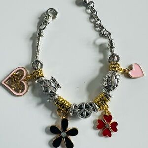 Charming Silver and Gold Bracelet with Heart and Flower Accents